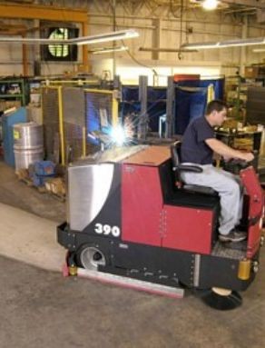 Image of a floor scrubber making quick work of factory and warehouse floors